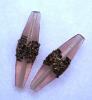 Oliva lunga, 38x10 mm., Rosa antico trasparente filigranato con bronzo
